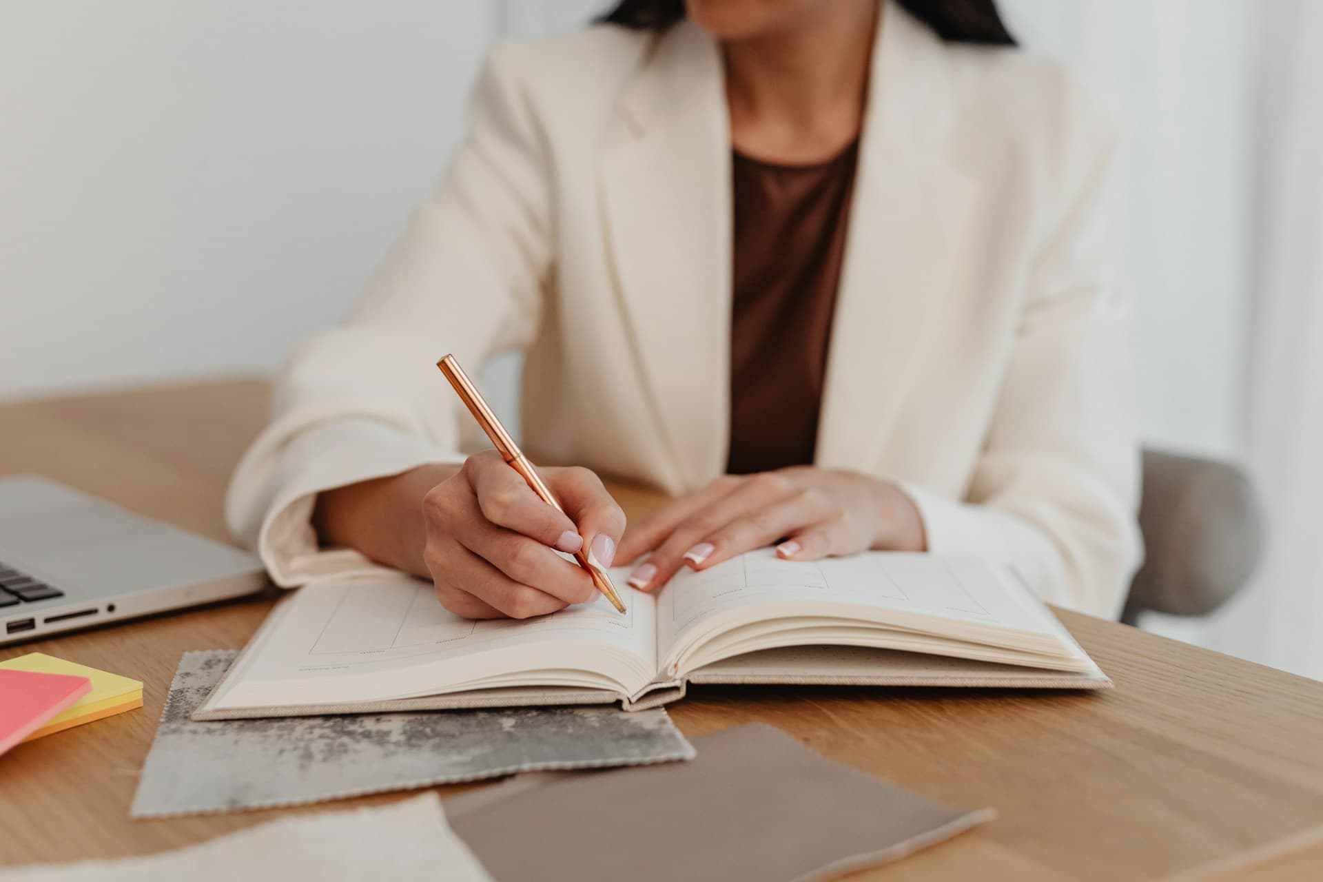 a woman writing in a book